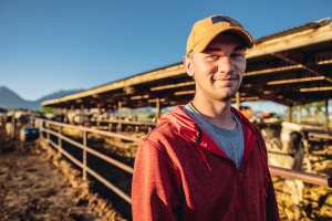 Young rancher on dairy farm